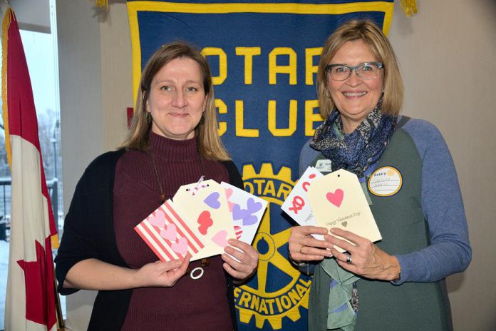 Hospice Peterborough executive director Hajni Hos and board president Shelley Barrie with some of the customized Valentine's Day cards that members of the Rotary Club of Peterborough Kawartha recently created for clients of the non-profit organization, which offers support to individuals and families living with or affected by life-threatening illness and grief. (Photo courtesy of Rotary Club of Peterborough Kawartha)