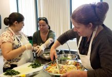 Chef Elaine McCarthy (right) coaches participants at the the Council for Persons with Disabilities' Active Together cooking class. The cooking classes, which are open to anyone over the age of 18 who self-identifies as living with a disability, run every Friday morning during the spring at Peterborough Public Health. (Photo: Council for Persons with Disabilities)