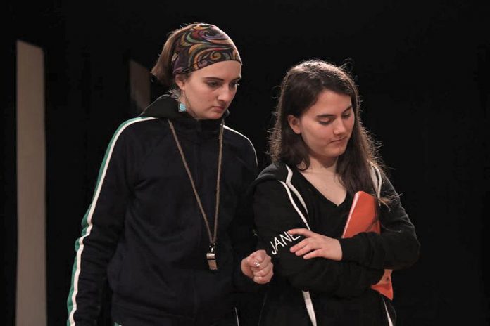 In Amanda Murray Cutalo's one-act comedy "Typecast", gym-teacher-turned-drama-teacher Ms. Ball (Taite Cullen, left) casts normally typecast student actors, including Jane "The Control Freak" (Lena Ross, right), against type in a high school play. Presented by youth theatre group Enter Stage Right, the play runs for one night only at the Peterborough Collegiate auditorium on February 29, 2020. (Photo: Dakota Hamilton) In Amanda Murray Cutalo's one-act comedy "Typecast", gym-teacher-turned-drama-teacher Ms. Ball (Taite Cullen, left) casts normally typecast student actors, including Jane "The Control Freak" (Lena Ross, right), against type in a high school play. Presented by youth theatre group Enter Stage Right, the play runs for one night only at the Peterborough Collegiate auditorium on February 29, 2020. (Photo: Dakota Hamilton)
