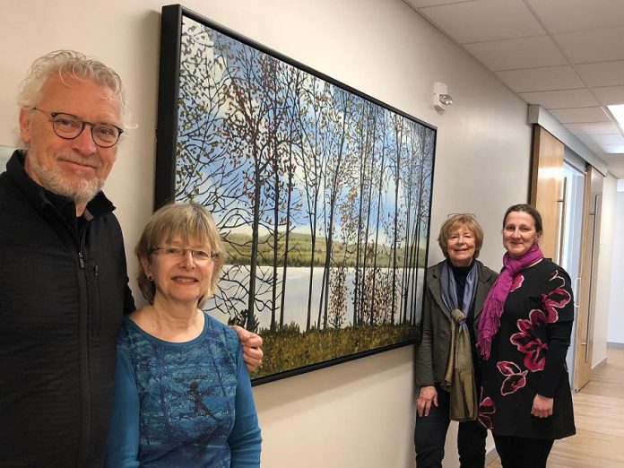 Peer and Lori Christensen (left) at Hospice Peterborough with the painting Peer created and donated to Hospice Peterborough. (Photo: Peer Christensen / Facebook)