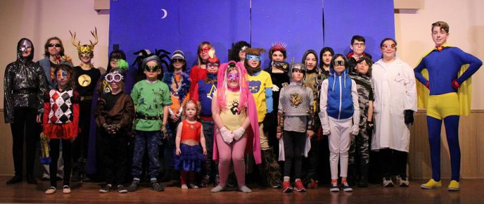 The cast of Funfolk Theatricals' production of "Calling All Sidekicks!", written and directed by Cavan children's author Shan McFadden. In the family play, which runs from March 15 to 17, 2020 at the Millbrook Legion, the 24 young actors perform as superheroes, supervillains, and their sidekicks. (Photo: Siobhan MacQuarrie)