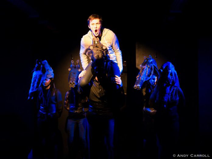 In The Theatre on King's production of Peter Shaffer's controverial and award-winning play "Equus", Conner Clarkin plays Alan Strang, a disturbed young man with an obsession for horses. Here, Conner's character rides the horse Nugget (played by a custumed Derek Bell) with other horse characters played by Naomi Duvall, Nikki Weatherdon, Samuelle Weatherdon, Ange Soransen, Dreda Blow. The play runs from Wednesday, March 11th and runs until Saturday, March 14th in downtown Peterborough. (Photo: Andy Carroll)