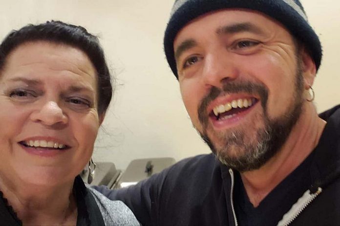 kawarthaNOW publisher Jeannine Taylor takes a selfie with Juno award-winning musician Hawksley Workman in the green room at Market Hall in downtown Peterborough during the Blackie and the Rodeo Kings concert on February 21, 2020. Hawksley says that, after arriving in Peterborough, he visited kawarthaNOW.com and immediately bought tickets for three events. (Photo: Jeannine Taylor)