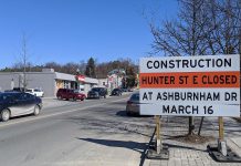 A construction notice on Hunter Street East looking east to Rogers Street in Peterborough's East City. Hunter Street East will be temporarily closed between Ashburnham Drive and Museum Drive on March 16, 2020, so there will be no access to Ashburnham Drive or Hunter Street East from the Peterborough Lift Lock tunnel. (Photo: Bruce Head / kawarthaNOW)