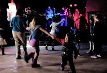 Peterborough reggae and ska band Dub Trinity are performing their annual tribute to Bob Marley this weekend at the Historic Red Dog in downtown Peterborough, with an evening show on Friday, March 6th followed by an all-ages matinee show at 2 p.m. on Saturday, March 7th when kids get in free. Pictured are kids dancing at the 2018 all-ages matinee show. (Photo: Selrahc Yrogerg via dubtrinity.com)