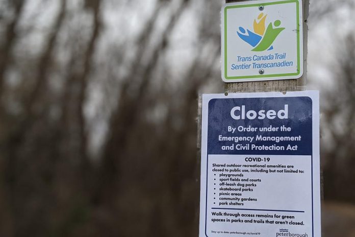 A closure notice posted by the City of Peterborough at the entrance to Ecology Park in Peterborough. On March 30, 2020, the Ontario government issued a new emergency order under the Emergency Management and Civil Protection Act to close all outdoor recreational amenities, such as sports fields and playgrounds, effective immediately. (Photo: Bruce Head / kawarthaNOW.com)