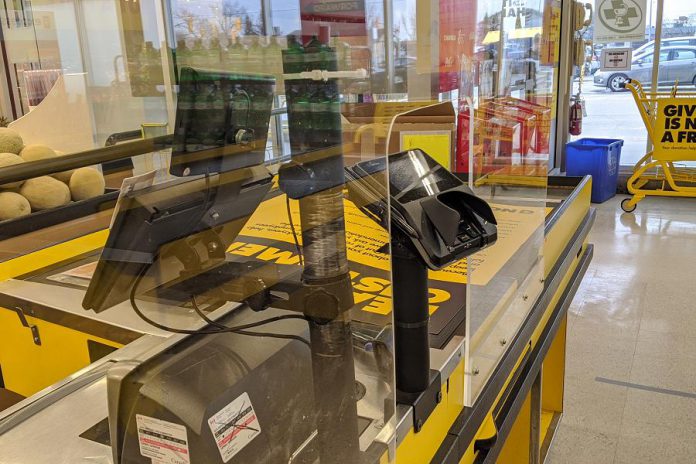 Grocery stores, such as No Frills in downtown Peterborough, are installing plexiglass shields at checkout counters. These shields help protect the health and safety of customers and store employees, and also help reduce the anxiety of cashiers.  (Photo: Bruce Head / kawarthaNOW.com)