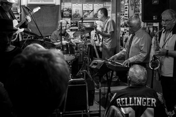 Paul Rellinger in the audience for the final Deluxe Blues Jam at the now-closed Pig's Ear Tavern in downtown Peterborough on April 15, 2017. The monthly Peterborough Musicians' Benevolent Association fundraiser then moved to Dr. J’s BBQ and Brews in downtown Peterborough, but has been cancelled until the state of emergency caused by the COVID-19 pandemic is over. (Photo: SLAB Productions)