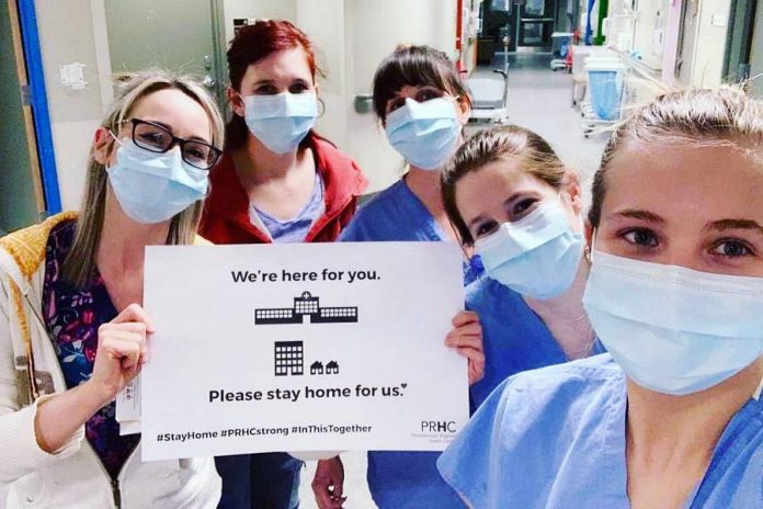 The first night shift crew on Peterborough Regional Health Centre's COVID-19 unit (from left to right: Aimee, Stephanie, Jessica, Emily, and Morgan) sharing the message "We're here for you. Please stay home for us.” (Photo by Moran via Jessica Scott-Salgado on Facebook)