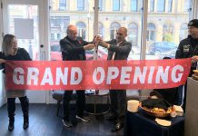 United Way campaign chair David Goyette and TVM Group president and CEO Amit Sofer cut the ribbon at the grand opening of the East City Condos showroom on October 26, 2019. TVM Group has donated $1,500 to United Way of Peterborough & District. (Supplied photo)