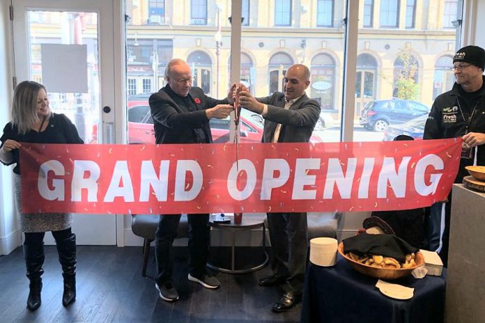 United Way campaign chair David Goyette and TVM Group president and CEO Amit Sofer cut the ribbon at the grand opening of the East City Condos showroom on October 26, 2019. TVM Group has donated $1,500 to United Way of Peterborough & District. (Supplied photo)