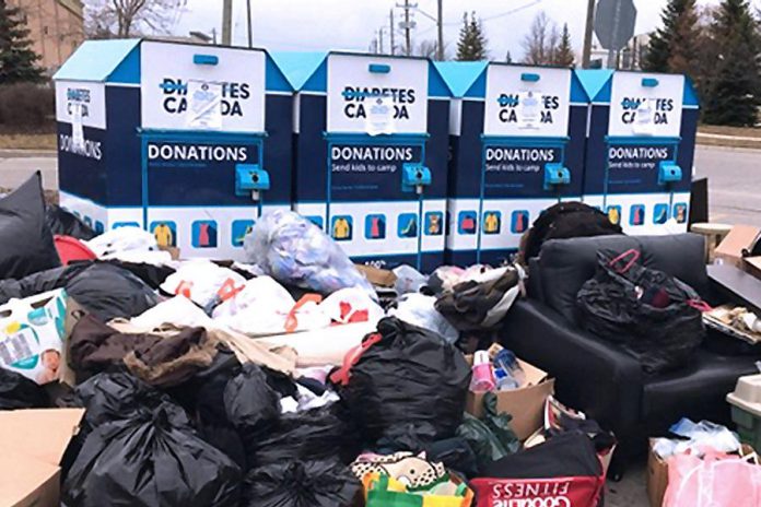 Some people are dumping clothing and other unwanted items Diabetes Canada donation bins during the COVID-19 pandemic, even though the charity has placed signs on the bins indicated the donations cannot be picked up and used right now. Some people are even dumping garbage and items unsuitable for donation at the bins, creating a serious health and safety issue. (Photo: Diabetes Canada)