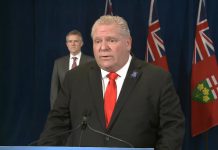 Ontario Premier Doug Ford, with Minister of Finance Rod Phillips behind him, announcing the new Ontario-Canada Emergency Commercial Rent Assistance Program on April 24, 2020. (Screenshot / YouTube)