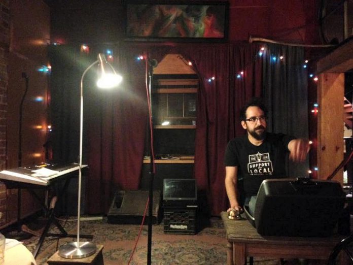 Performance artist Justin Million, shown performing at his regular Show and Tell poetry series before the COVID-19 lockdown, has recently had to cancel all scheduled National Poetry Month programming for the series. (Photo: Andy Carroll)