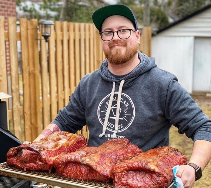 In this week's GreenUP column, Tyler Scott, chef and co-owner of Rare in downtown Peterborough, provides some tips on how to make the best use of ingredients in your kitchen at home. Here he's pictured retrieving some striploin from his smoker. During the COVID-19 pandemic, Rare and a number of other local restaurants have established safe food delivery and takeout options. (Photo: Rare / Facebook)
