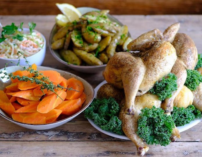 The Electric City Bread Company is offering family-style takeout, such as this roast chicken dinner with carrots and roasted potatoes. (Photo: Jonathan Linton)