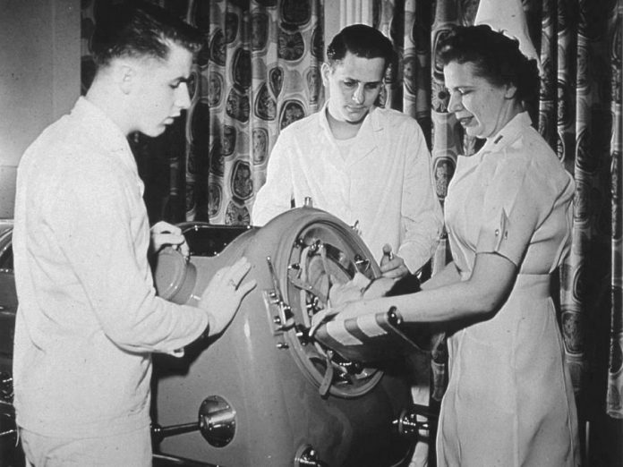 A polio patient in the "iron lung", an artificial respirator for patients suffering from paralytic polio developed by Philip Drinker and Louis Agassiz Shaw Jr. in 1929. (Photo: National Library of Medicine)