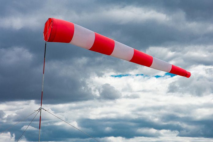 Windsock blowing in strong winds on a cloudy day