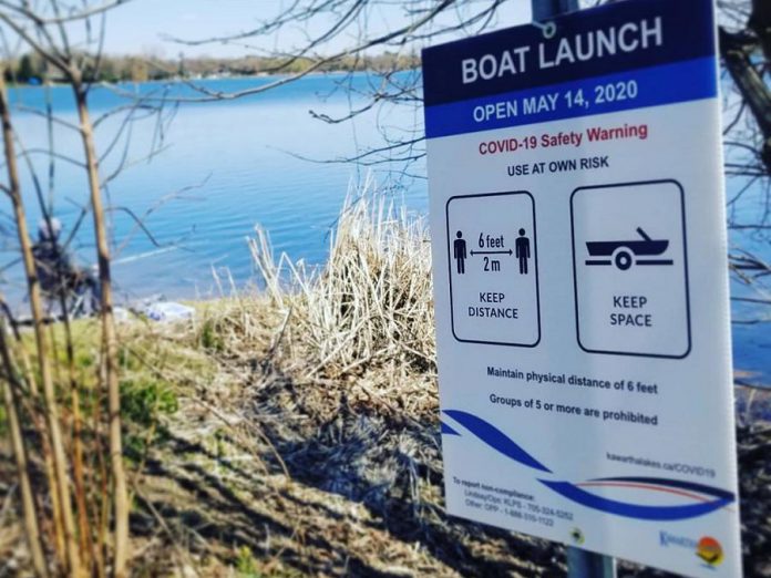 A sign posted by the municipality of Kawartha Lakes advising a boat launch on Washburn Island in Lake Scugog is now open After closing all public boat launches on April 2, 2020, the municipality reopened them on May 14th in time for the Victoria Day long weekend. (Photo: Astrid Hood / @astridhood Instagram)