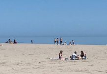 The Cobourg Police Service released this photo of Victoria Beach in Cobourg showing only small gatherings on the beach on May 23, 2020, the same day when an estimated 10,000 people gathered at Toronto's Trinity Bellwoods Park. (Photo: Cobourg Police Service)