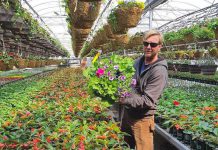 Greenhouse manager Kyle Griffin at Griffin's Greenhouses in Selywn, one of many locally owned independent garden centres in the Kawarthas that are ready to open to the public for gardening season once the Ontario government gives them the green light. Currently, they can only offer curbside pickup and delivery instead of allowing customers to browse plants. (Photo: Griffin's Greenhouses / Instagram)