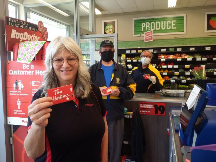 Grocery store workers at Foodland on Hunter Street in Peterborough with Tim Hortons gift cards distributed by the Rotary Club of Peterborough Kawartha to thank the workers for their service. (Photo courtesy of Rotary Club of Peterborough Kawartha)