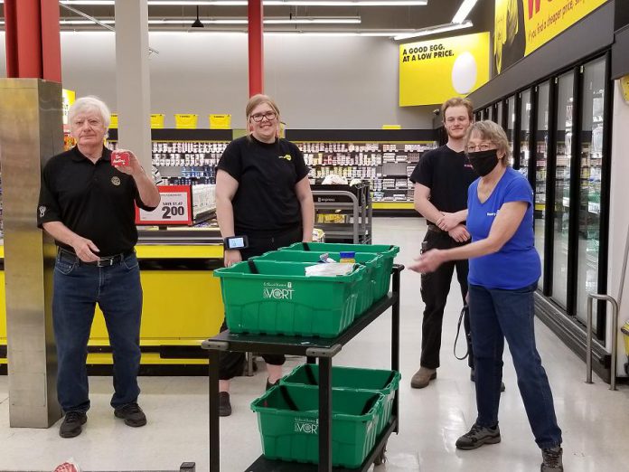 Grocery store workers at No Frills on George Street with their Tim Hortons gift cards distributed by the Rotary Club of Peterborough Kawartha. Rotarians distributed a total of 100 gift cards to workers at three local grocery stores to thank them for their service. (Photo courtesy of Rotary Club of Peterborough Kawartha)