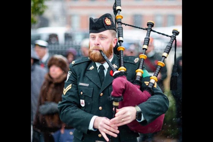 Master Corporal Maury McCrillis playing the lament at the Peterborough cenotaph at a Remembrance Day ceremony. (Photo: Hastings & Prince Edward Regiment Pipe Band / Facebook)