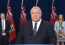 Ontario Premier Doug Ford announces the province's enhanced COVID-19 testing strategy at a media briefing at Queen's Park on May 29, 2020, along with Ontario's chief medical officer of health Dr. David Williams and health minister Christine Elliott. (Screenshot / CPAC)