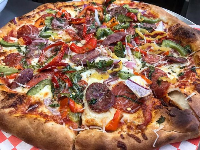 Taso's Restaurant and Pizzeria and Kewley Security Inc., both in downtown Peterborough, have teamed up to deliver free pizza, wings, and salad to 50 families on May 11, 2020. (Photo: Taso’s Restaurant and Pizzeria)