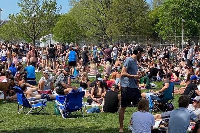 Recent increases in the number of positive COVID-19 cases in Ontario and this large group gathering at Trinity Bellwoods Park in Toronto on May 24, 2020 has prompted the Ontario government to extend all emergency orders, including the five-person restriction on social gatherings, until June 9, 2020. (Photo: Dr. Eileen de Villa / Twitter)