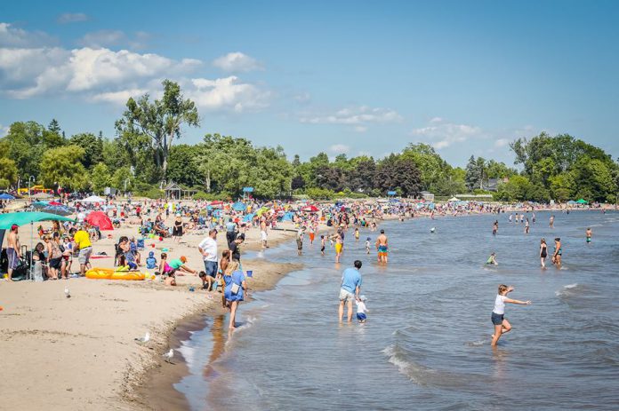 Pre-pandemic crowds at Victoria Beach on Lake Ontario in Cobourg, popular with both residents and out-of-town visitors from Toronto. While the Town of Cobourg has reopened Victoria Beach to the public with public health directives and the province's emergency order prohibiting gatherings of more than five people still in place, similar directives did not prevent thousands of people from packing Trinity Bellwoods Park in Toronto on May 23, 2020. (Photo courtesy of Linda McIlwain)