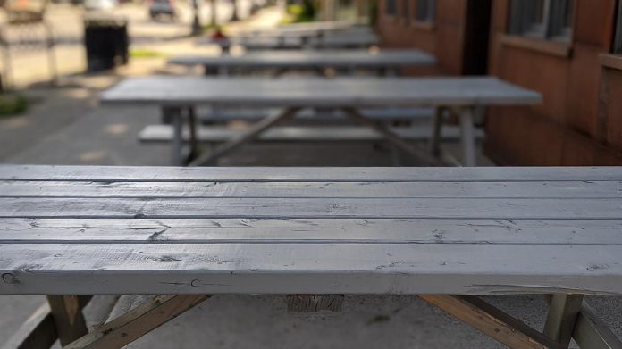 Cold beer will soon be sitting on these picnic tables at Ashburnham Ale House in Peterborough's East City. To help meet public health and safety requirements for physical distancing, owner Scott Wood purchased six picnic tables to replace the previous seating on the front patio. (Photo: Bruce Head / kawarthaNOW.com)