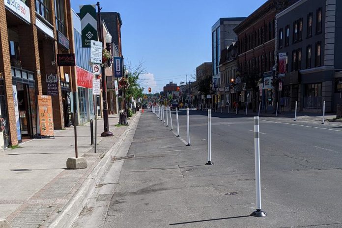 Sections of George and Water streets are restricted to vehicular traffic to create extra space for pedestrians on the roadway as restaurant patios and pop-up commercial space make use of the sidewalks. (Photo: Bruce Head / kawarthaNOW.com)