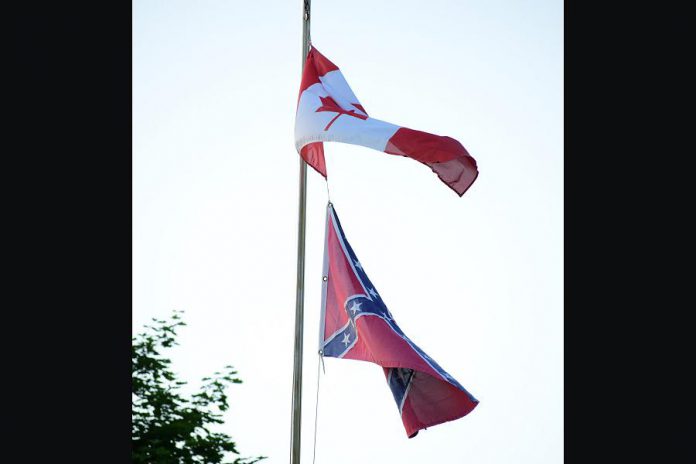 A home in Lakefield is flying a Confederate flag along with the Canadian flag. Peterborough resident Mark L. Craighead objects to the display of the flag as a symbol of hate that has no place in society. (Photo courtesy of Mark L. Craighead)