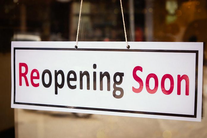 A "reopening soon" sign in the window of a business