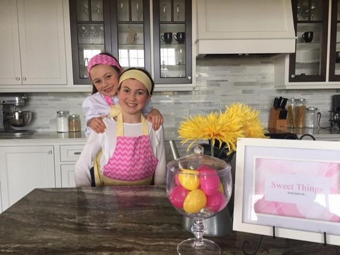 With the help of their mom Jenn, sisters Ella and Myriah Mason launched Sweet Things Bakehouse from their home in Oakwood, east of Lindsay in Kawartha Lakes, in late March. The girls have raised over $1,100 for two local causes. (Photo: Jenn Mason)