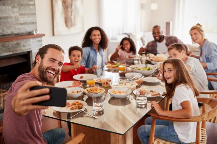 Two families dining together