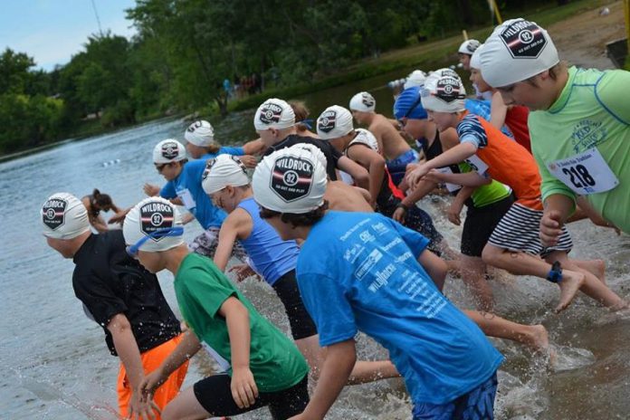 Children enter this water from the beach at Beavermead Park in Peterborough during a past Dr. Shufelt's Kids Triathlon. Organizers have cancelled the popular fundraising event in 2020 due to the COVID-19 pandemic. (Photo: Dr. Shufelt's Kids Triathlon / Facebook)