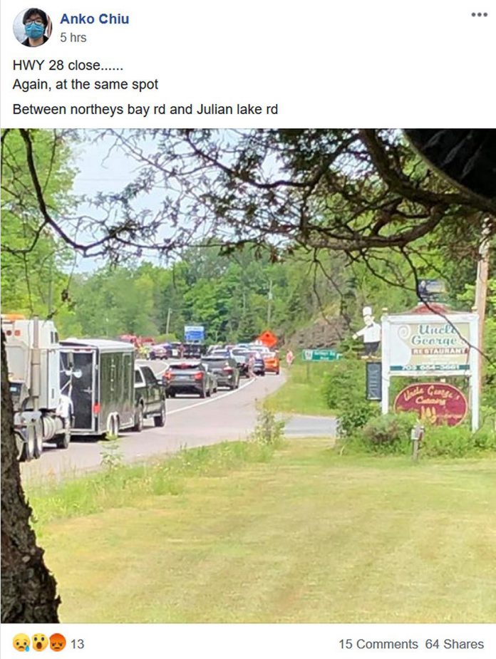 A photo of backed-up traffic on Highway 28 near the scene of the head-on collision on July 5, 2020, posted in the Concerned Citizens of North Kawartha Facebook group. (Screen capture)