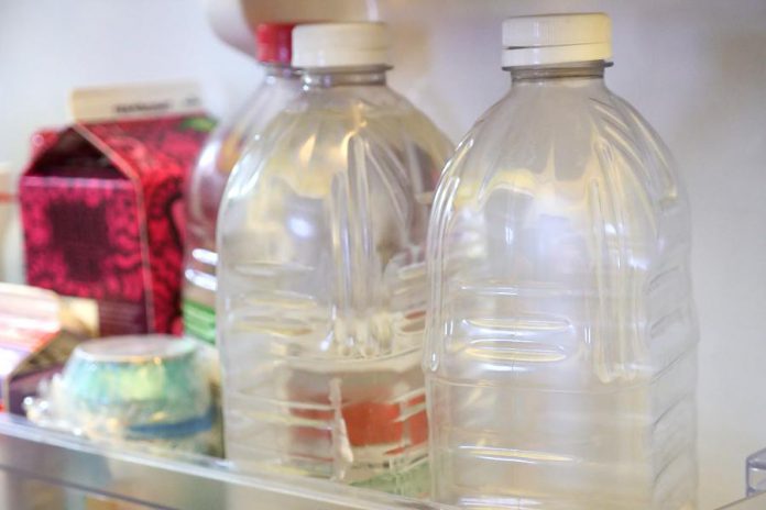 Another good way to help conserve water indoors is to keep jugs of tap water in your fridge. This way you can avoid running the tap each time you want a cold drink of water. (Photo:  Benjamin Hargreaves / GreenUP)