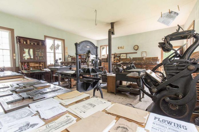 The Register Print Shop building at Lang Pioneer Village Museum in Keene was built in the 1840s, originally serving as a school in South Monaghan Township. It was common for a printer to take over an existing building for his print shop. The large windows made this building a good choice as the natural light would make the printer's precise work easier. Most of the printing equipment displayed in Lang's print shop including over ninety job cases of wooden and metal type, a proof press, and the more efficient foot-powered Golding press was donated by a former owner of the old Norwood Register. (Text and photo courtesy of  Lang Pioneer Village Museum)