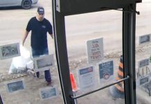 Surveillance footage shows a man who dumped two bags of garbage inside a Lindsay office on July 23, 2020. (Police-supplied photo)