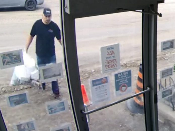 Surveillance footage shows a man who dumped two bags of garbage inside a Lindsay office on July 23, 2020. (Police-supplied photo)