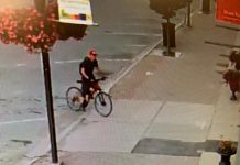 This man is wanted in connection with a purse-snatching incident in Lindsay on July 26, 2020. (Police-supplied photo)