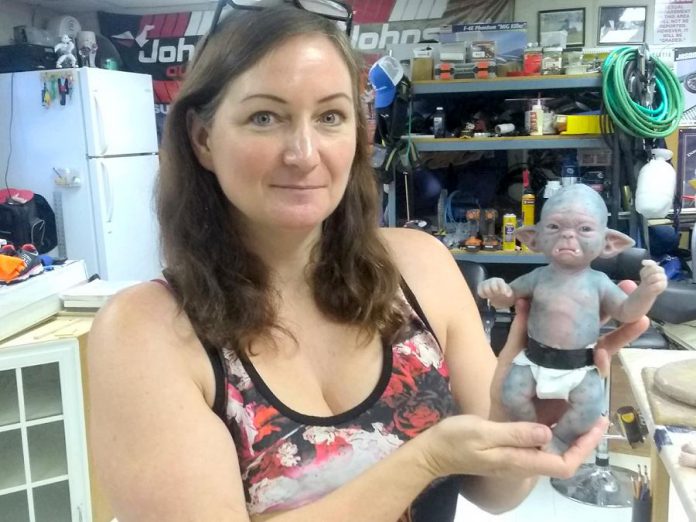 Award-winning makeup FX artist Rhonda Causton displays one of her popular baby orcs in her Omemee studio. When the film industry shut down because of the COVID-19 pandemic, Rhonda began to create and sell her creations online to keep busy. She says she's actually making a better living now than from her film work. (Photo: Sam Tweedle / kawarthaNOW.com)