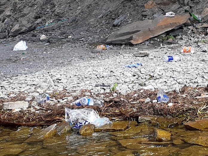 People are fishing from the edge of James A. Gifford Causeway day and night, often leaving their garbage behind for local businesses and residents to clean up. (Photo: Wylie Harold)