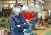 A factory worker wearing a mask. (Stock photo)