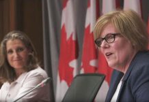 Canada's finance minister Chrystia Freeland and employment minister Carla Qualtrough announcing the extension of the Canada Emergency Response Benefit for another month and new recovery benefits in the employment insurance program on Parliament Hill on August 20, 2020. (CPAC screenshot)