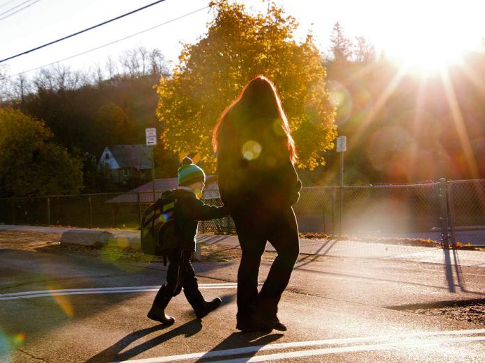 Figuring out a way to work active transportation into the school commute is a great way of relieving some stress during the day. If you must drive your kids to school, consider parking a few blocks away and walking the rest of the way. (Photo: GreenUP)